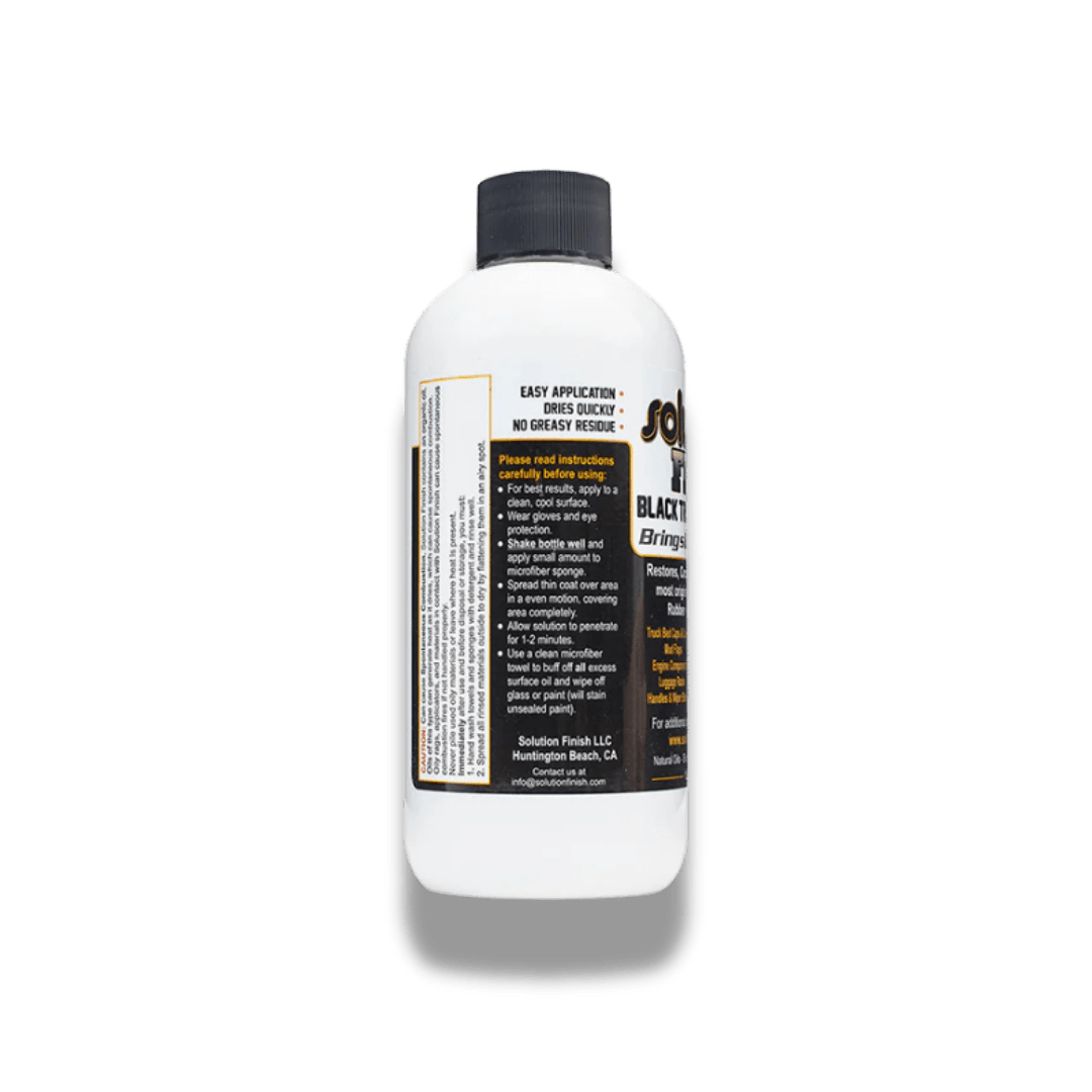 A bottle of Solution Finish Solution Finish Black Trim Restorer on a white background.
