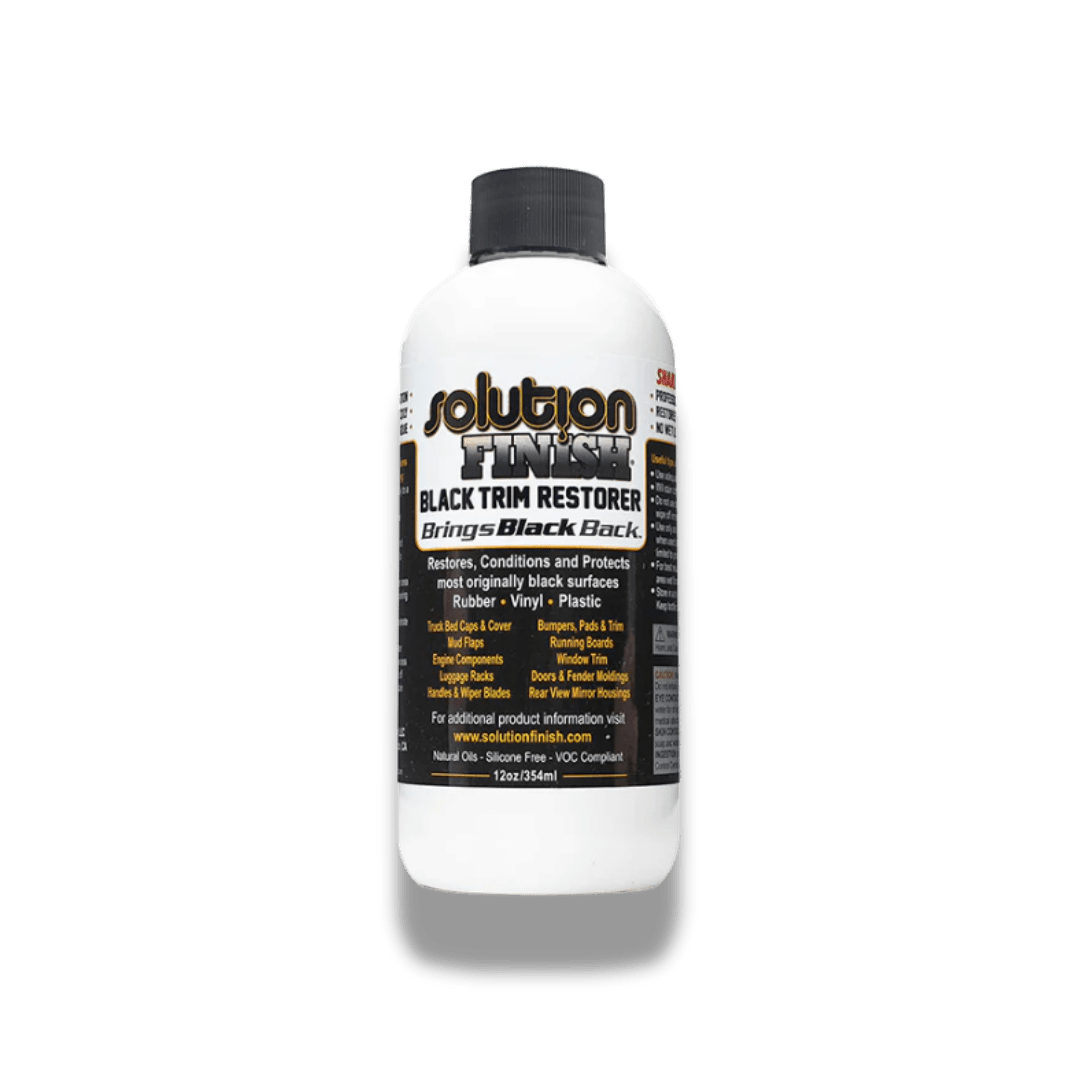 A bottle of Solution Finish Solution Finish Black Trim Restorer on a white background.