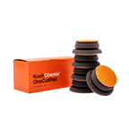 A bottle of Koch Chemie One Cut Pad on a white background.